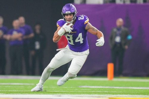 Nov 3, 2024; Minneapolis, Minnesota, USA; Minnesota Vikings tight end Josh Oliver (84) runs after the catch against the Indianapolis Colts in the second quarter at U.S. Bank Stadium.