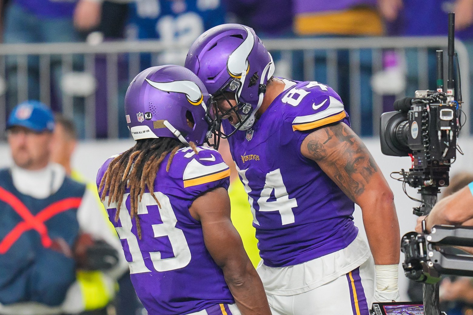 Nov 3, 2024; Minneapolis, Minnesota, USA; Minnesota Vikings tight end Josh Oliver (84) celebrates his touchdown with wide receiver Jalen Nailor (83) against the Indianapolis Colts in the fourth quarter at U.S. Bank Stadium.