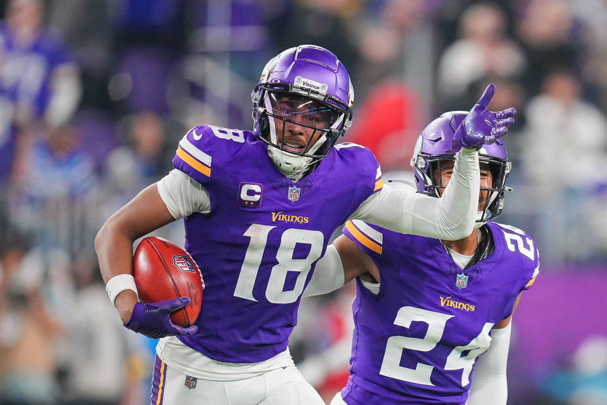 Nov 3, 2024; Minneapolis, Minnesota, USA; Minnesota Vikings wide receiver Justin Jefferson (18) celebrates catching the onside kick against the Indianapolis Colts in the fourth quarter at U.S. Bank Stadium.