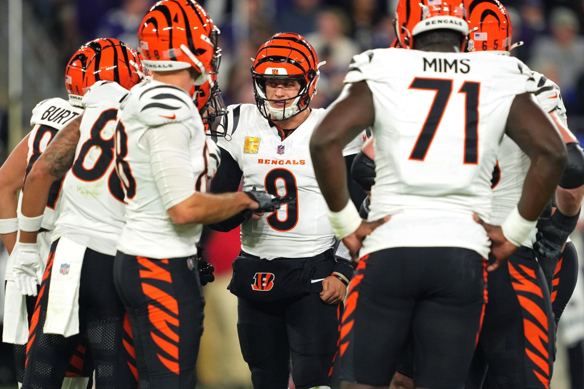 Nov 7, 2024; Baltimore, Maryland, USA; Cincinnati Bengals quarterback Joe Burrow (9) in the huddle against the Baltimore Ravens during the first quarter at M&T Bank Stadium.