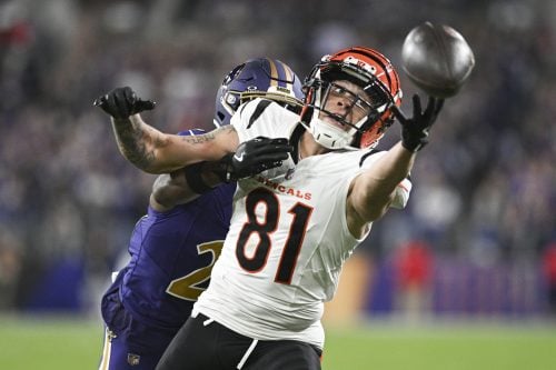 Nov 7, 2024; Baltimore, Maryland, USA; Cincinnati Bengals wide receiver Jermaine Burton (81) reaches for quarterback Joe Burrow (not pictured) throws ass Baltimore Ravens cornerback Brandon Stephens (21) defends during the second half at M&T Bank Stadium.