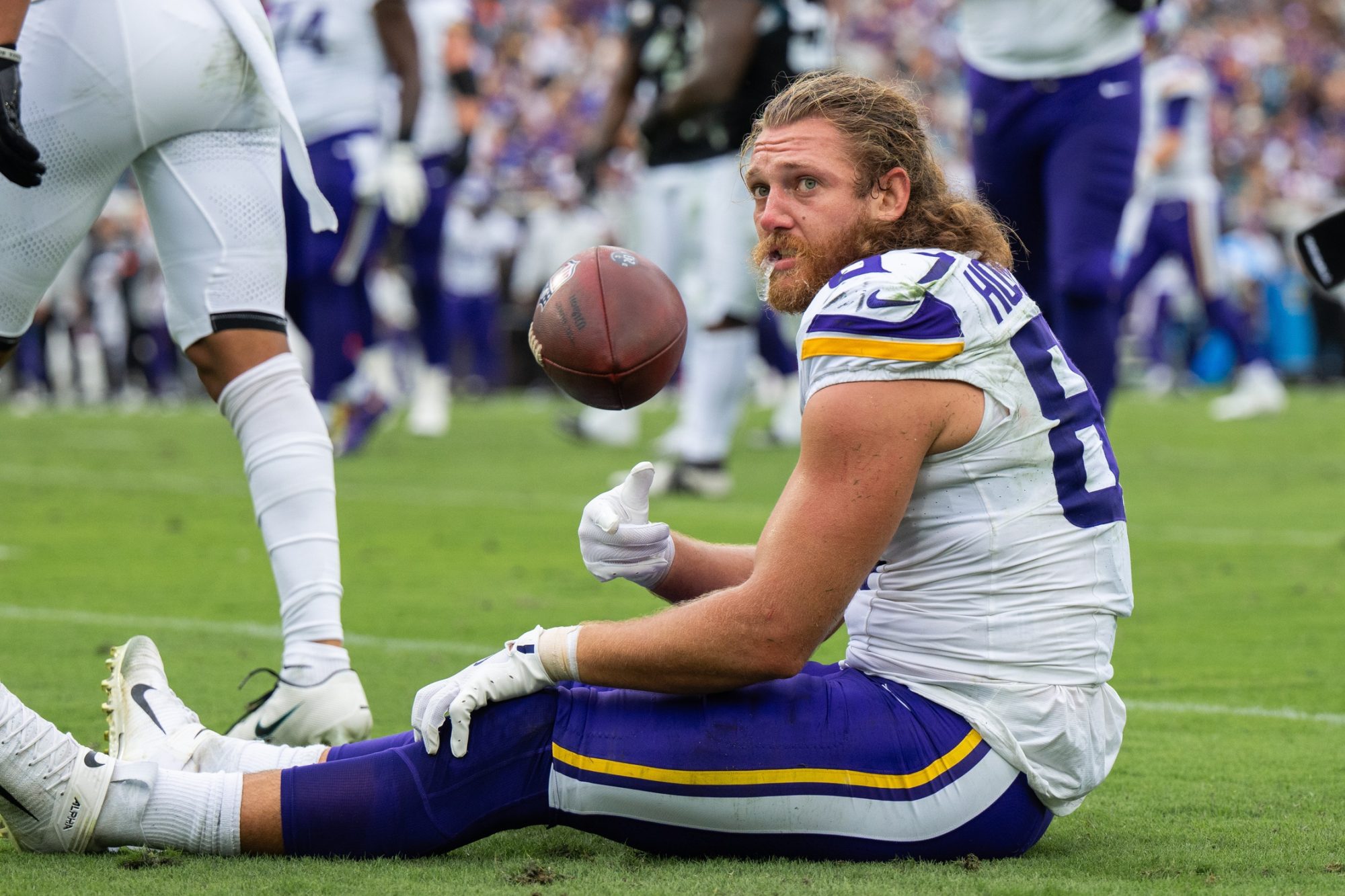 Nov 10, 2024; Jacksonville, Florida, USA; Minnesota Vikings tight end T.J. Hockenson (87) gets his helmet knocked off after the first down against the Jacksonville Jaguars in the second quarter at EverBank Stadium.