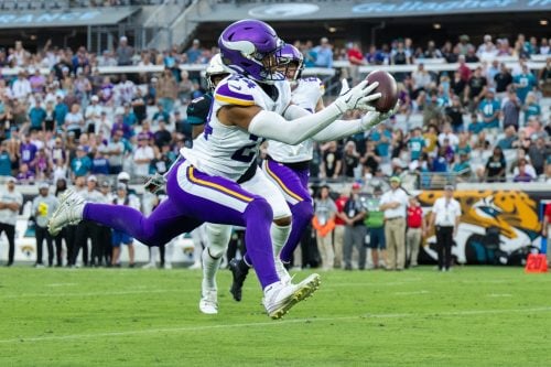 Nov 10, 2024; Jacksonville, Florida, USA; Minnesota Vikings safety Camryn Bynum (24) makes the interception against the Jacksonville Jaguars in the fourth quarter at EverBank Stadium.