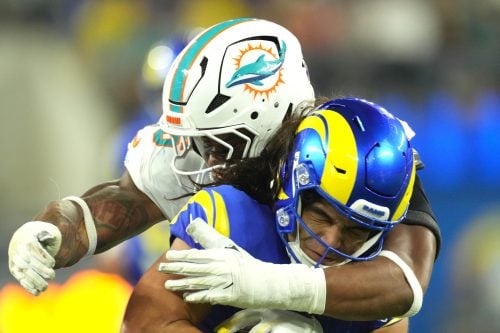 Nov 11, 2024; Inglewood, California, USA; Los Angeles Rams wide receiver Puka Nacua (17) is tackled by Miami Dolphins linebacker Quinton Bell (56) in the second half at SoFi Stadium.