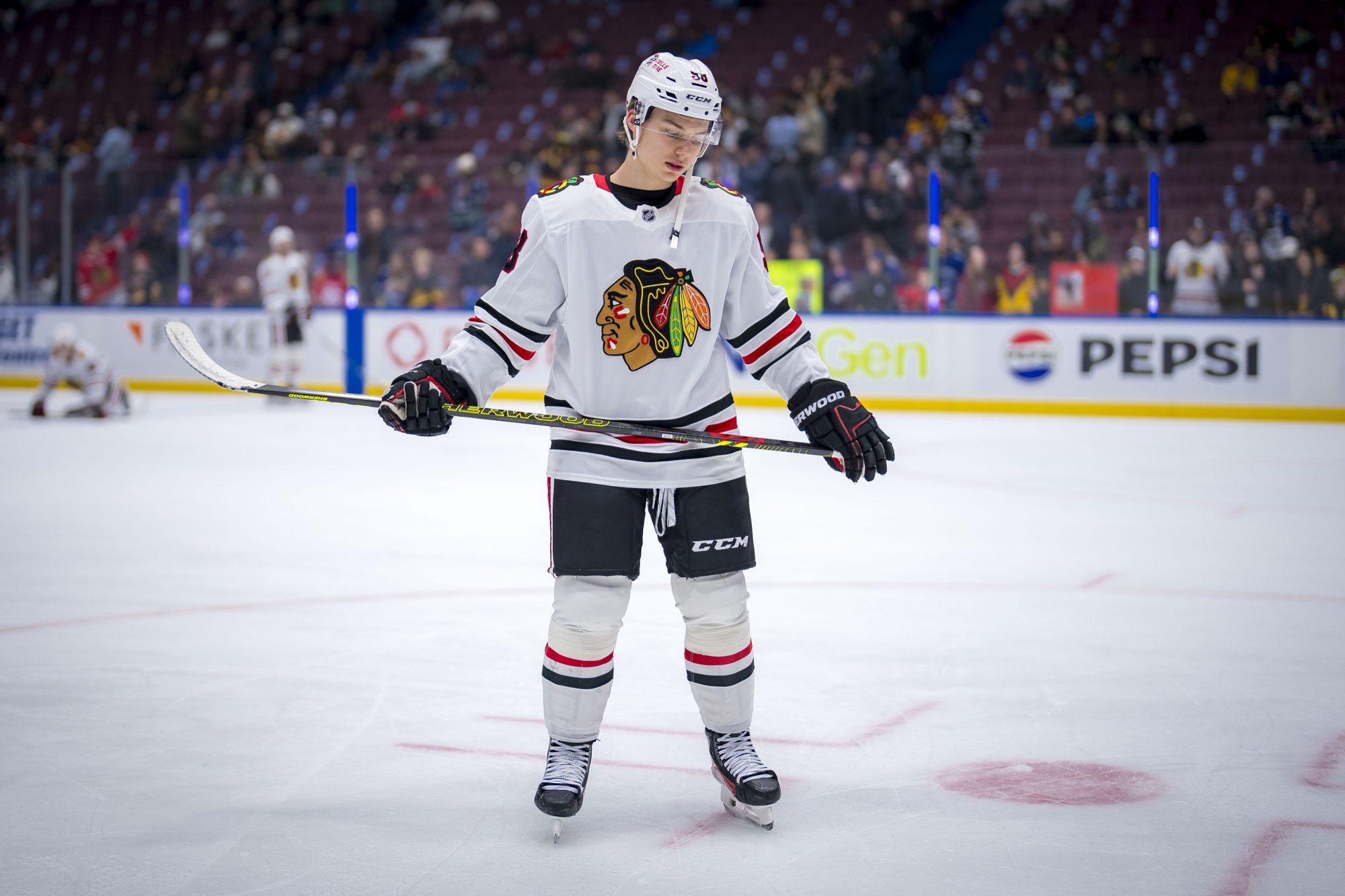 Nov 16, 2024; Vancouver, British Columbia, CAN; Chicago Blackhawks forward Connor Bedard (98) rests during warm up prior to a game against the Vancouver Canucks at Rogers Arena.