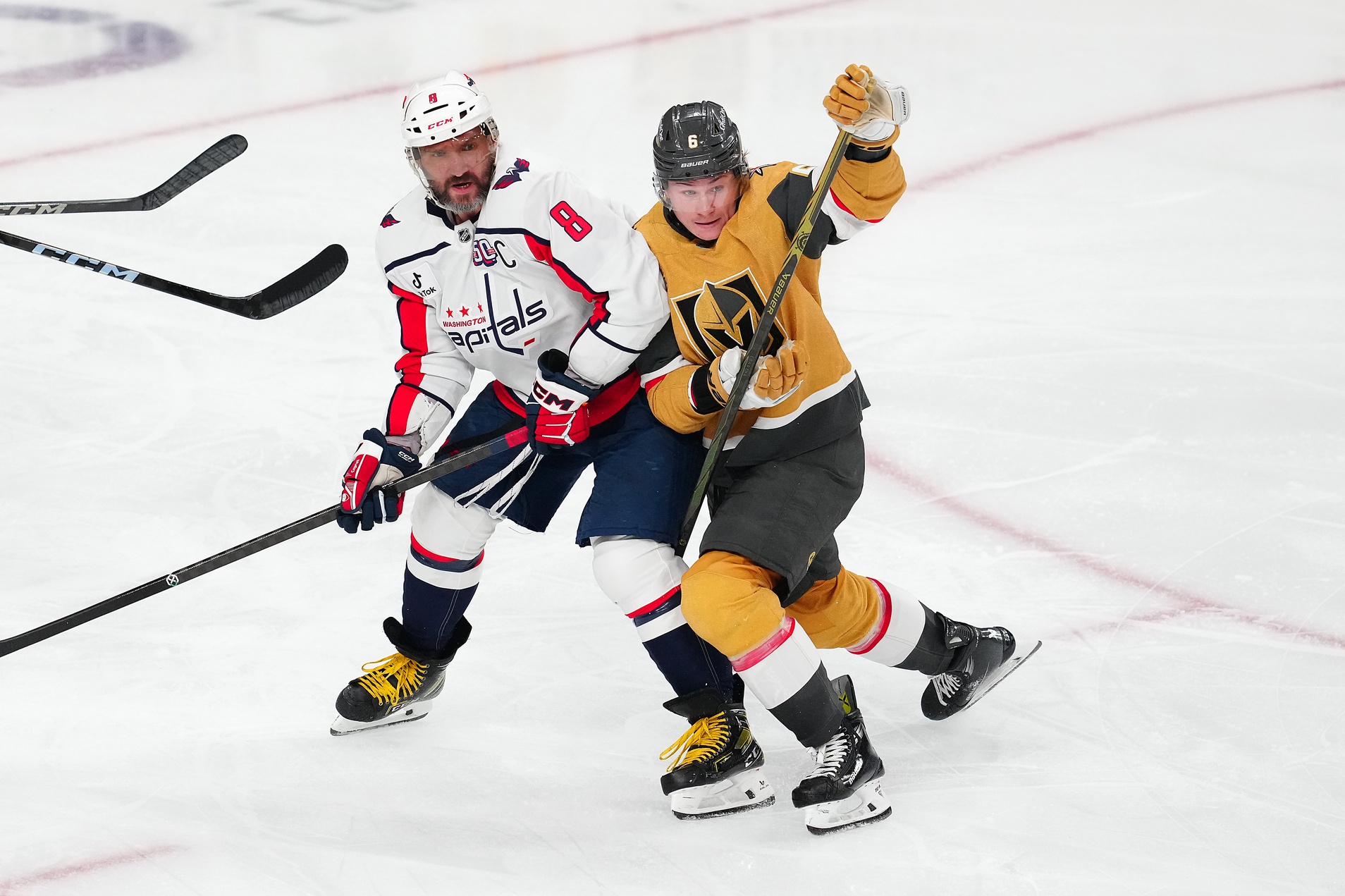 Nov 17, 2024; Las Vegas, Nevada, USA; Vegas Golden Knights defenseman Kaedan Korczak (6) covers Washington Capitals left wing Alex Ovechkin (8) during the third period at T-Mobile Arena.