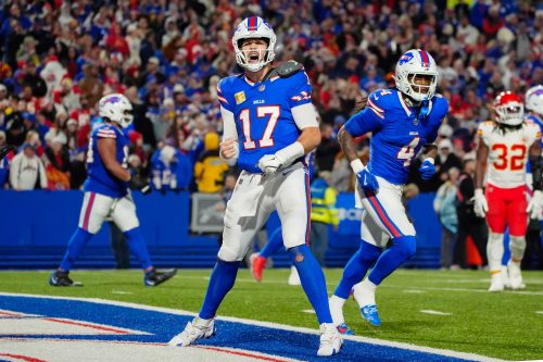 Nov 17, 2024; Orchard Park, New York, USA; Buffalo Bills quarterback Josh Allen (17) reacts to scoring a touchdown against the Kansas City Chiefs during the second half at Highmark Stadium.