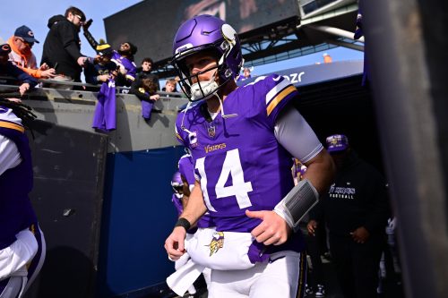 Nov 24, 2024; Chicago, Illinois, USA; Minnesota Vikings quarterback Sam Darnold (14) enters the field before the game against the Chicago Bears at Soldier Field.