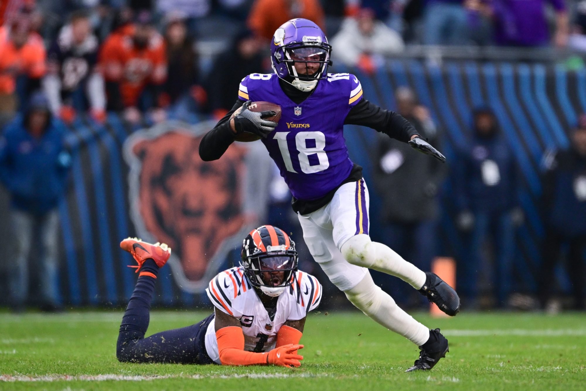 Nov 24, 2024; Chicago, Illinois, USA; Minnesota Vikings wide receiver Justin Jefferson (18) runs after a catch against the Chicago Bears during overtime at Soldier Field.