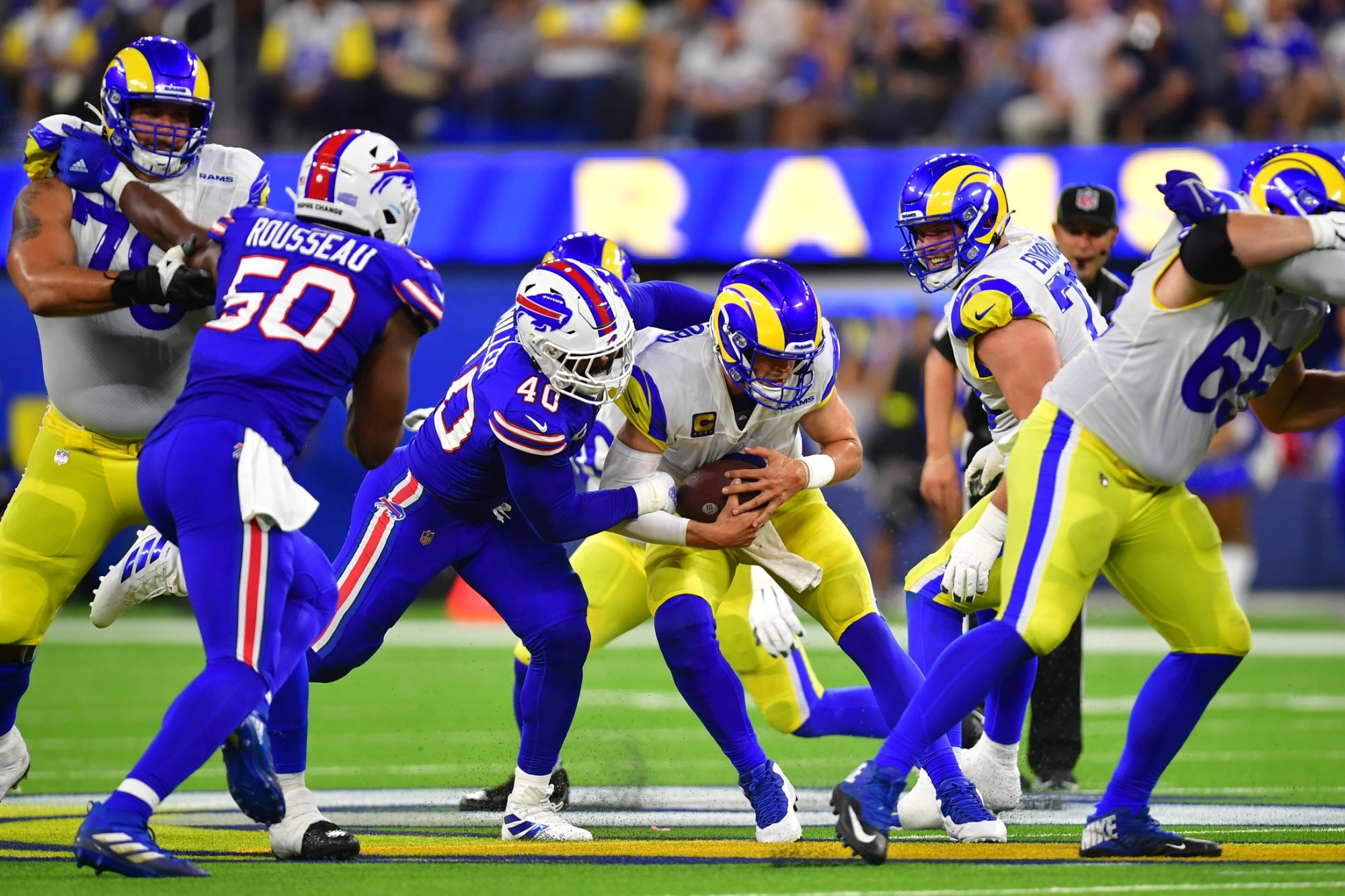 Sep 8, 2022; Inglewood, California, USA; Los Angeles Rams quarterback Matthew Stafford (9) is brought down by Buffalo Bills linebacker Von Miller (40) in the third quarter at SoFi Stadium.