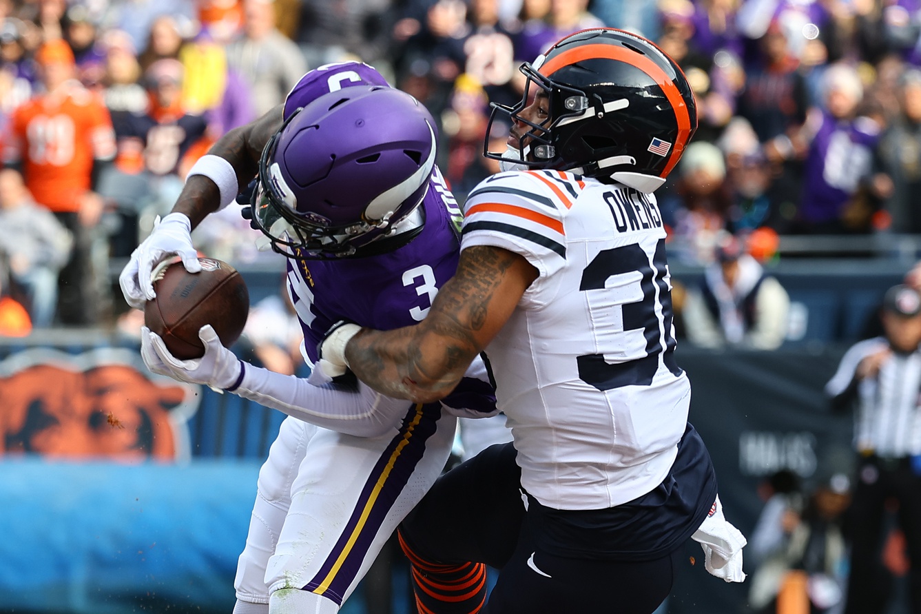 Nov 24, 2024; Chicago, Illinois, USA; Minnesota Vikings wide receiver Jordan Addison (3) catches a touchdown pass against Chicago Bears safety Jonathan Owens (36) during the second quarter at Soldier Field.