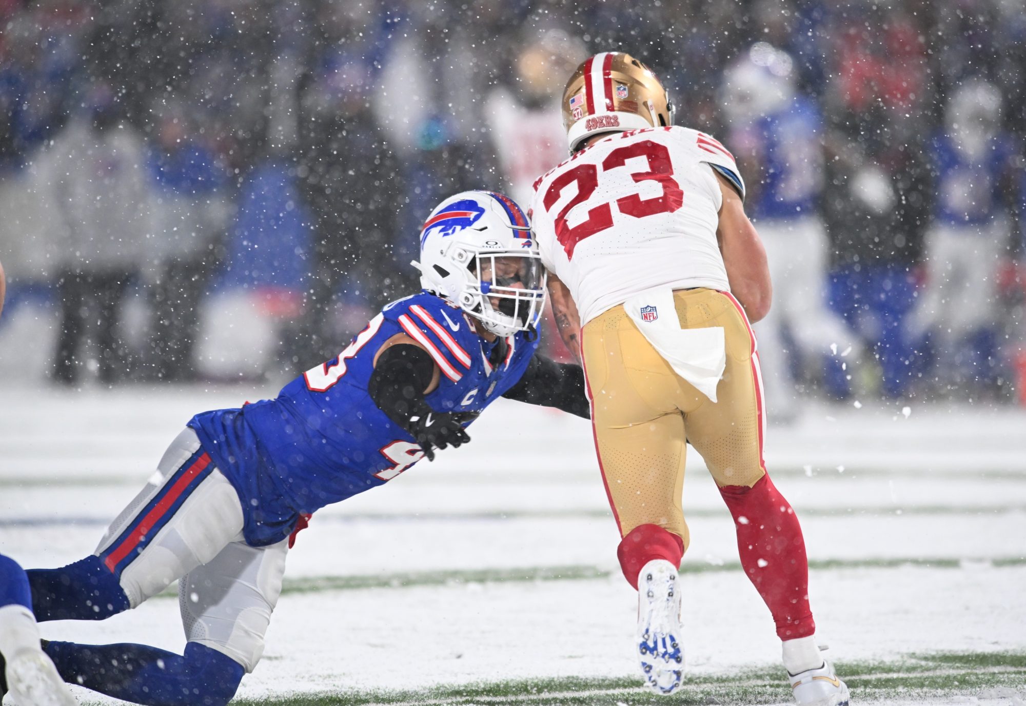 Dec 1, 2024; Orchard Park, New York, USA; Buffalo Bills linebacker Terrel Bernard (43) makes a tackle on San Francisco 49ers running back Christian McCaffrey (23) in the second quarter at Highmark Stadium.