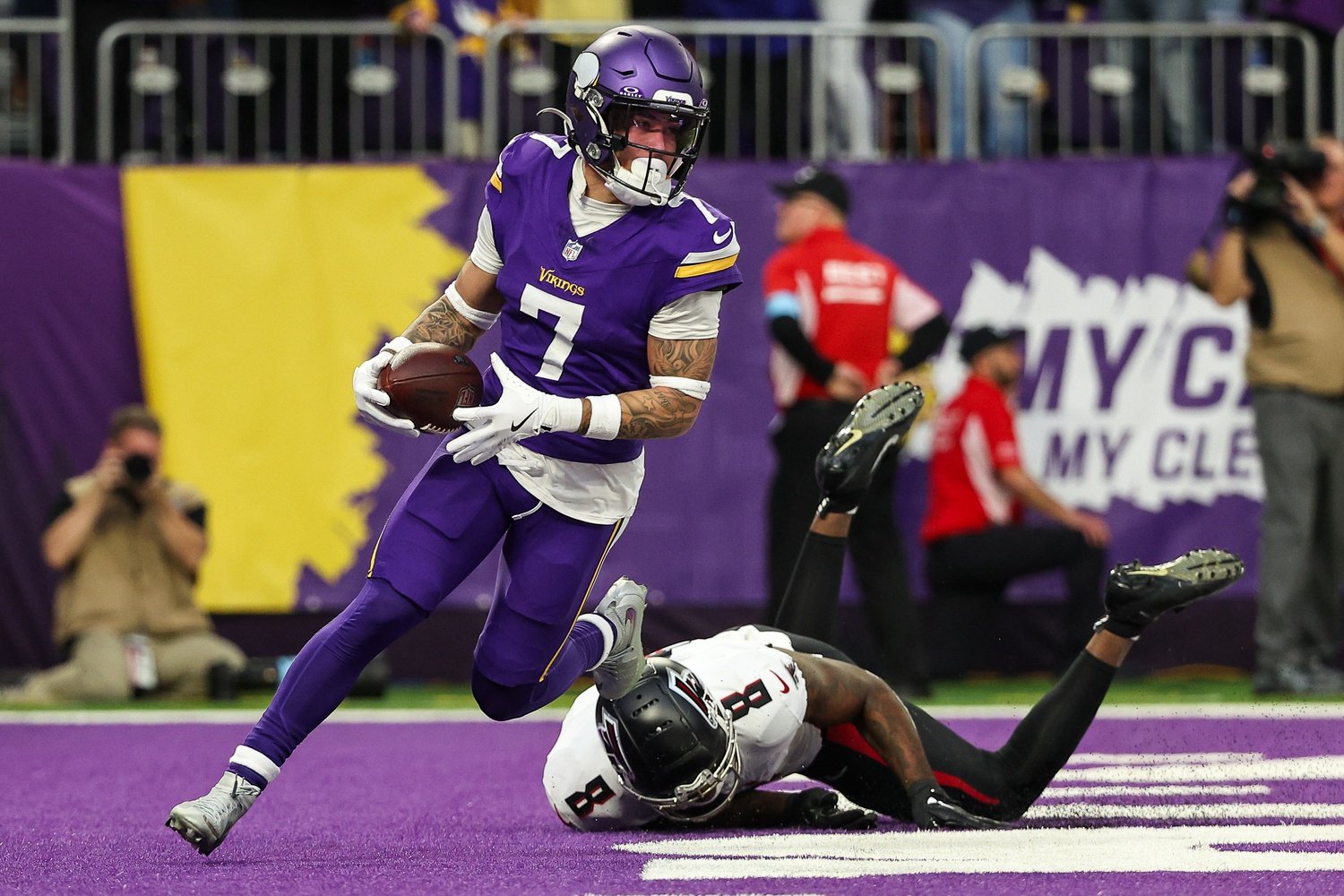 Dec 8, 2024; Minneapolis, Minnesota, USA; Minnesota Vikings cornerback Byron Murphy Jr. (7) intercepts a pass intended for Atlanta Falcons tight end Kyle Pitts (8) during the fourth quarter at U.S. Bank Stadium.