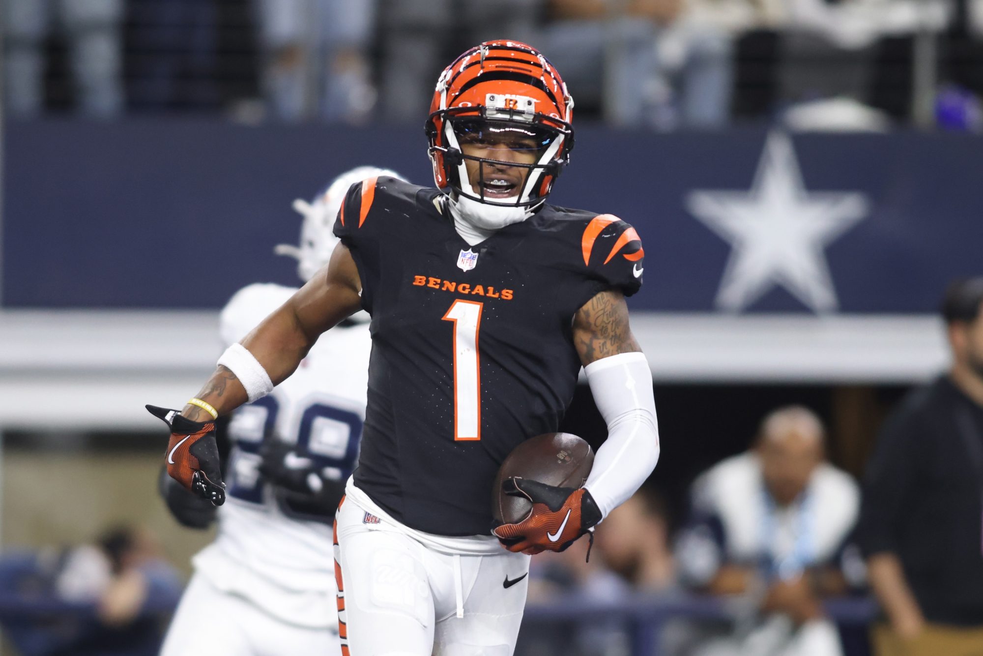 Dec 9, 2024; Arlington, Texas, USA; Cincinnati Bengals wide receiver Ja'Marr Chase (1) scores a touchdown against the Dallas Cowboys in the fourth quarter at AT&T Stadium.