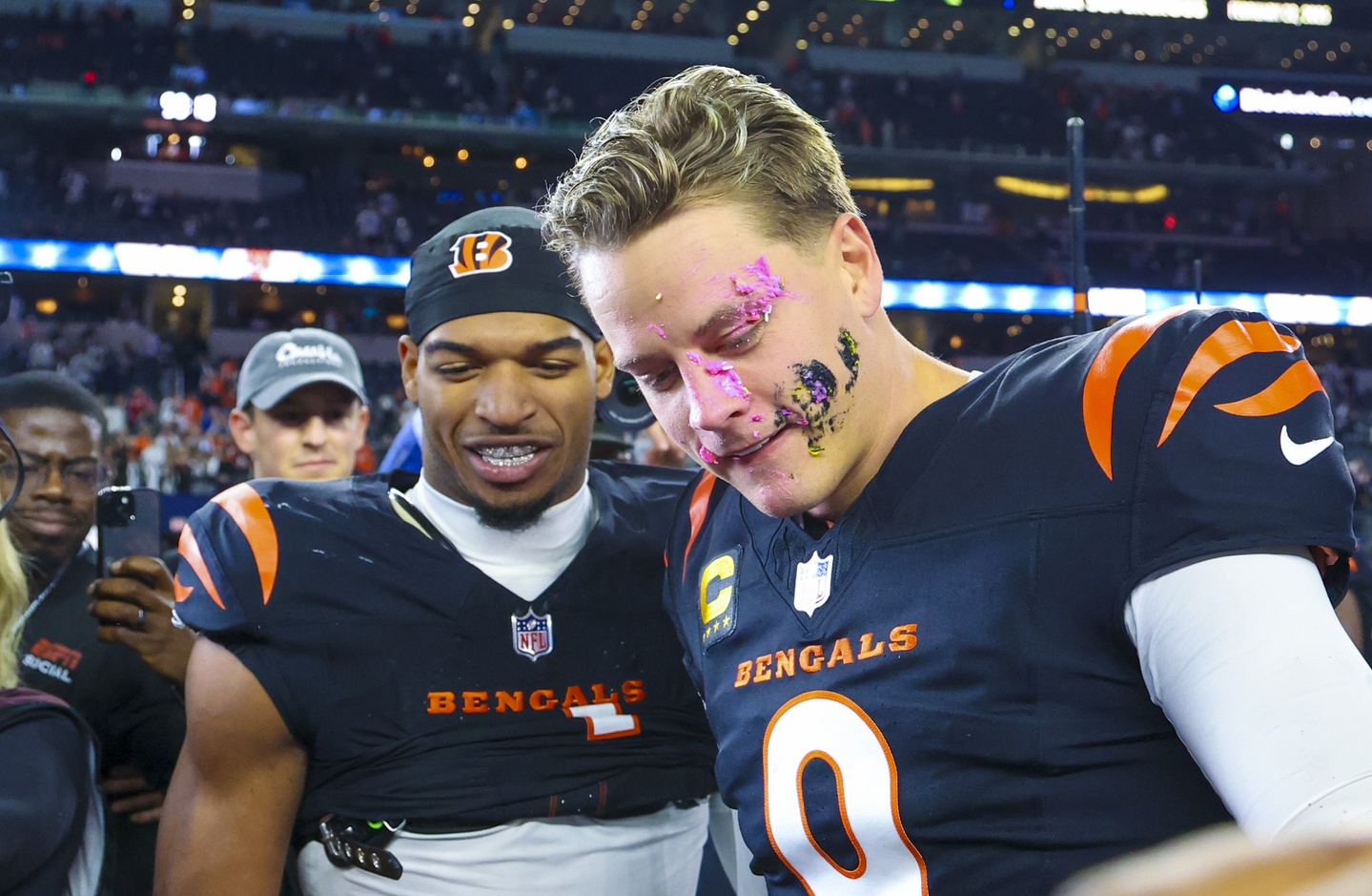 Dec 9, 2024; Arlington, Texas, USA; Cincinnati Bengals wide receiver Ja'Marr Chase (1) smashes a donut on the face of Cincinnati Bengals quarterback Joe Burrow (9) after the game against the Dallas Cowboys at AT&T Stadium.