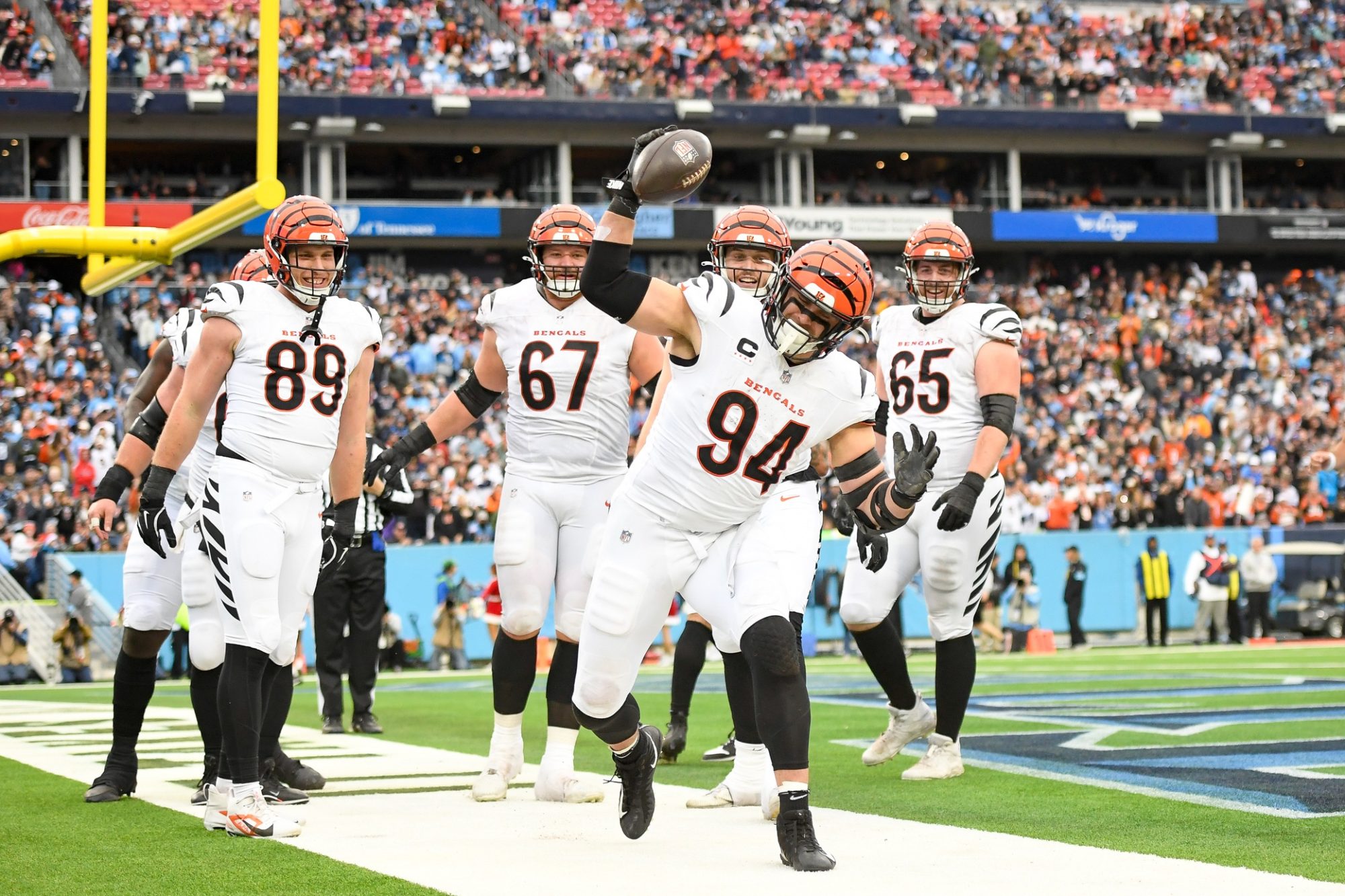 Dec 15, 2024; Nashville, Tennessee, USA; Cincinnati Bengals defensive end Sam Hubbard (94) celebrates his touchdown with his teammates against the Tennessee Titans during the first half at Nissan Stadium.