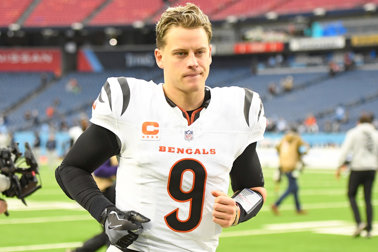 Dec 15, 2024; Nashville, Tennessee, USA; Cincinnati Bengals quarterback Joe Burrow (9) runs off the field against the Tennessee Titans during the second half at Nissan Stadium.