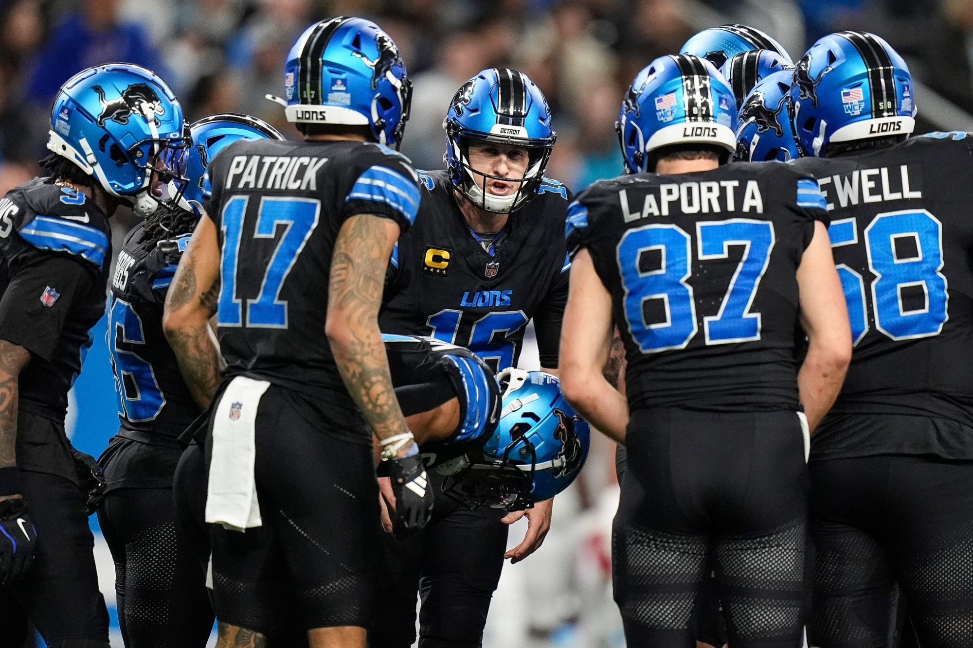 Detroit Lions quarterback Jared Goff (16), center, talks in the huddle before a play against Buffalo Bills during the second half at Ford Field in Detroit on Sunday, Dec. 15, 2024.