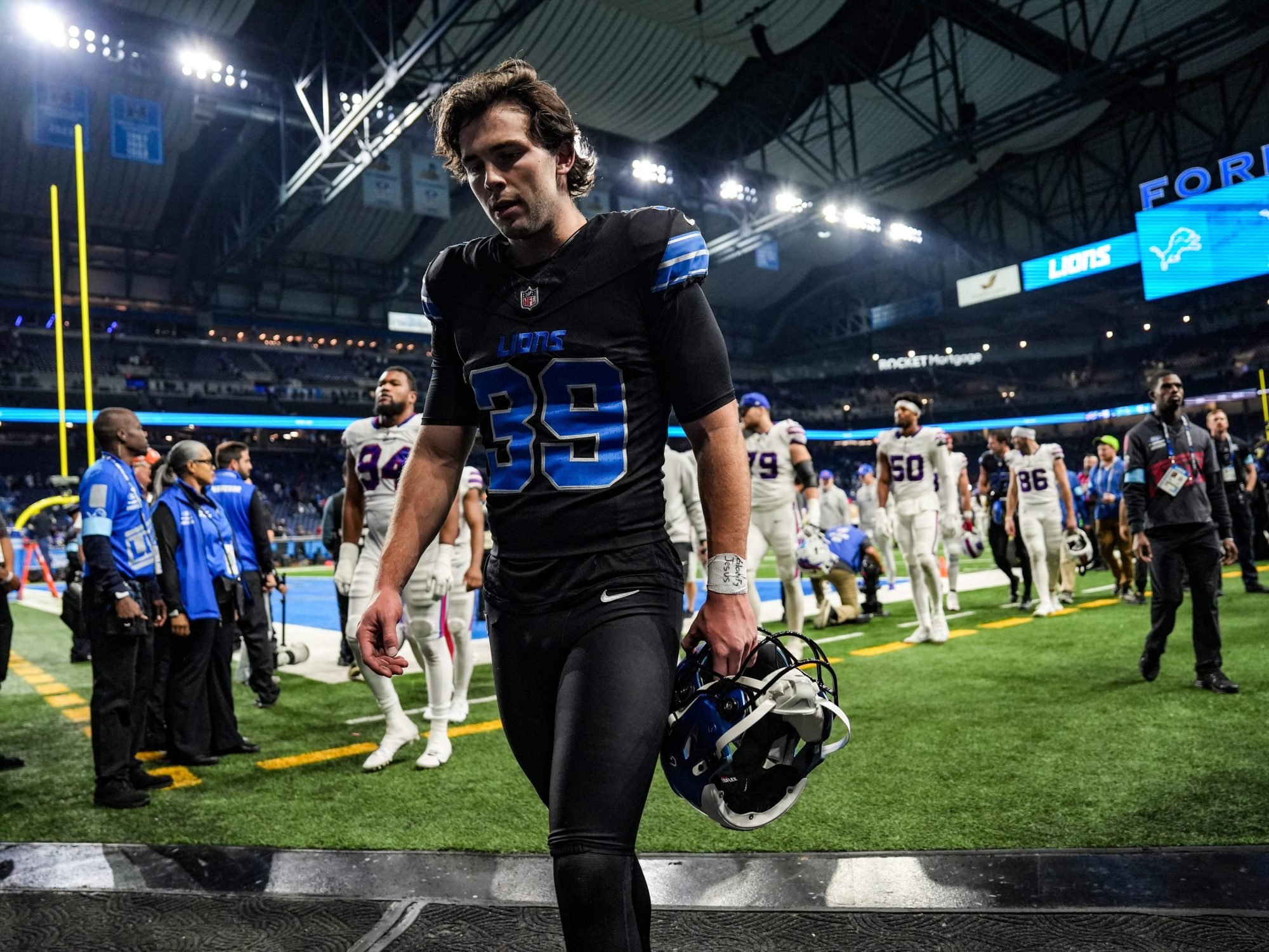 Detroit Lions place kicker Jake Bates (39) walks off the field after losing to the Buffalo Bills 48-42, during the second half at Ford Field in Detroit on Sunday, Dec. 15, 2024.