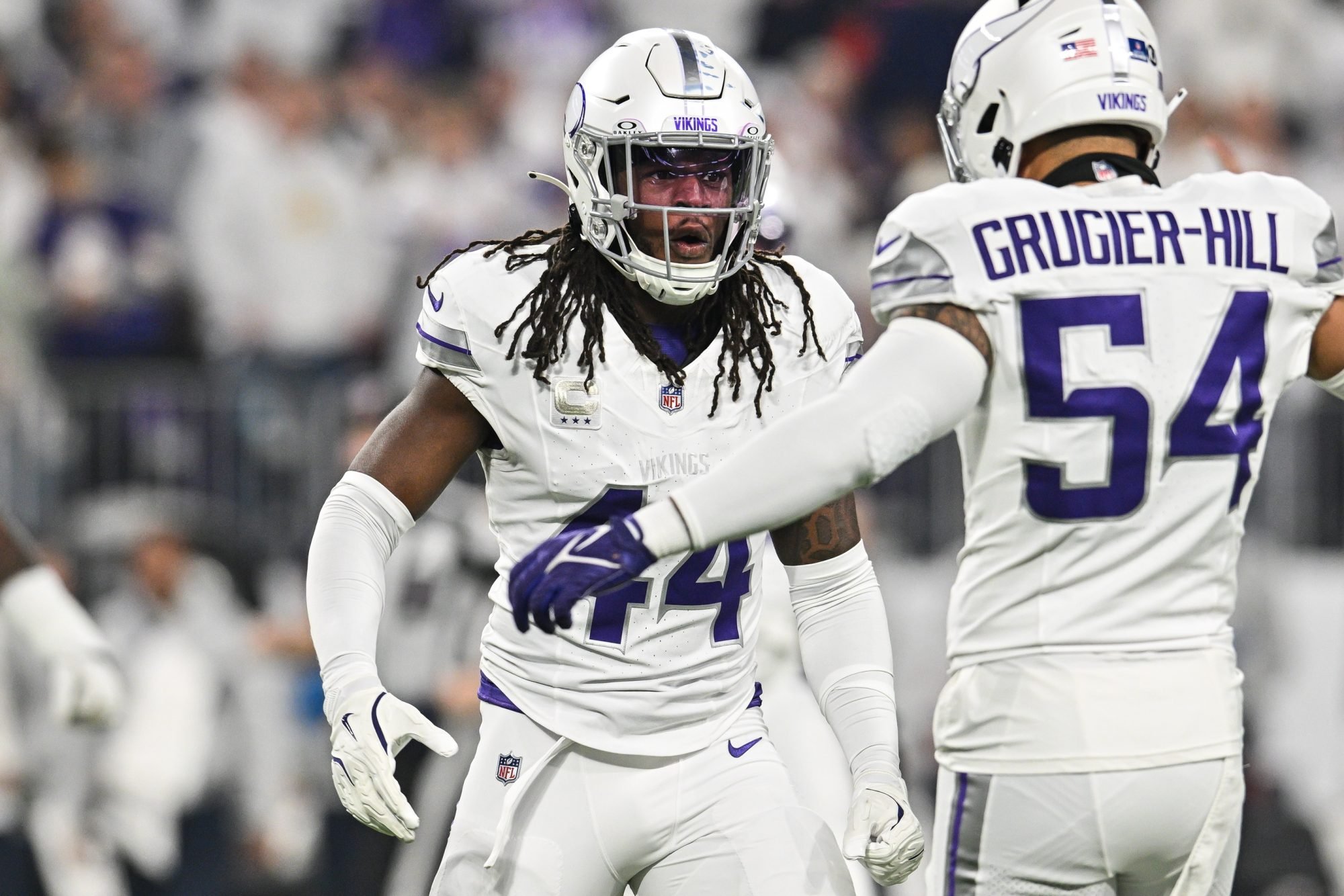 Dec 16, 2024; Minneapolis, Minnesota, USA; Minnesota Vikings safety Josh Metellus (44) reacts with linebacker Kamu Grugier-Hill (54) after a fourth down stop against the Chicago Bears during the first quarter at U.S. Bank Stadium.