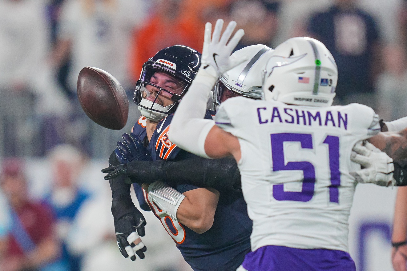 Dec 16, 2024; Minneapolis, Minnesota, USA; Chicago Bears quarterback Caleb Williams (18) is sacked by Minnesota Vikings linebacker Jonathan Greenard (58) in the first quarter at U.S. Bank Stadium.