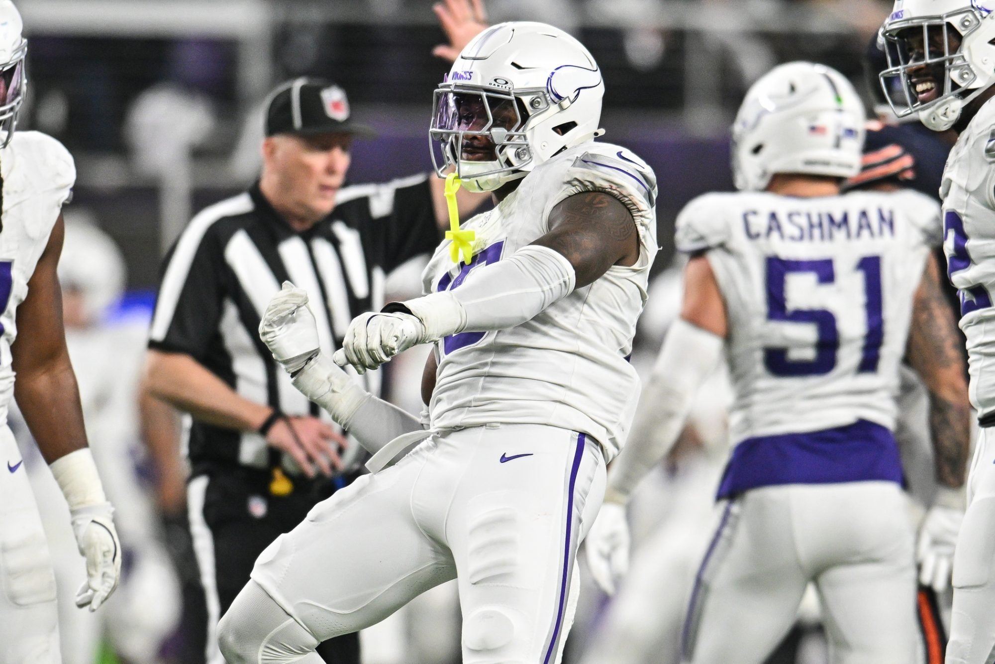 Dec 16, 2024; Minneapolis, Minnesota, USA; Minnesota Vikings linebacker Dallas Turner (15) reacts after a sack during the fourth quarter against the Chicago Bears at U.S. Bank Stadium.