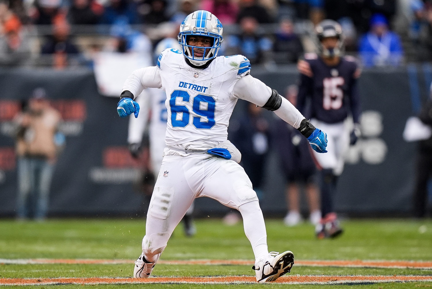 Detroit Lions linebacker Al-Quadin Muhammad (69) celebrates a sack against Chicago Bears quarterback Caleb Williams (18) during the second half at Soldier Field in Chicago, Ill. on Sunday, Dec. 22, 2024.