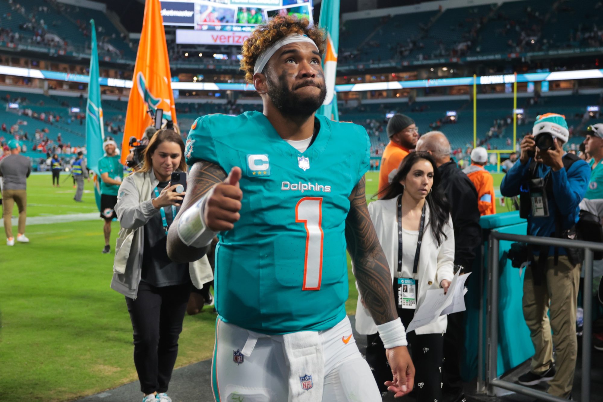 Dec 22, 2024; Miami Gardens, Florida, USA; Miami Dolphins quarterback Tua Tagovailoa (1) reacts front field after theme against the San Francisco 49ers at Hard Rock Stadium.