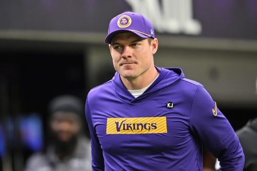 Dec 29, 2024; Minneapolis, Minnesota, USA; Minnesota Vikings head coach Kevin O'Connell walks onto the field before the game against the Green Bay Packers at U.S. Bank Stadium.