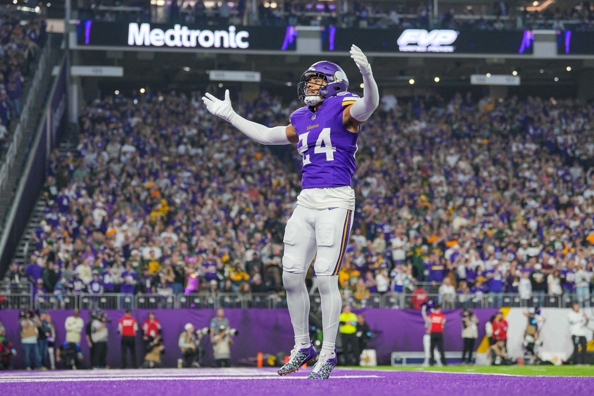 Dec 29, 2024; Minneapolis, Minnesota, USA; Minnesota Vikings safety Camryn Bynum (24) interacts with fans against Green Bay Packers in the first quarter at U.S. Bank Stadium.