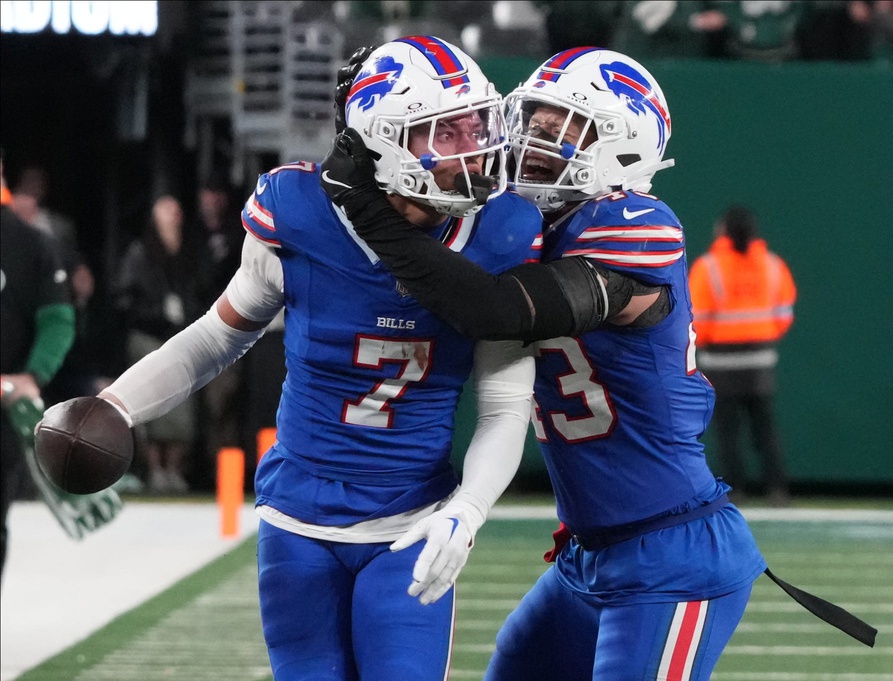 East Rutherford, NJ -- October 14, 2024 -- Taron Johnson of Buffalo and Terrel Bernard of Buffalo after Johnson intercepted a pass, ending a late game drive for the Jets. The Buffalo Bills came to MetLife Stadium to play the NY Jets. The Jets played their first game under new interim head coach Jeff Ulbrich.