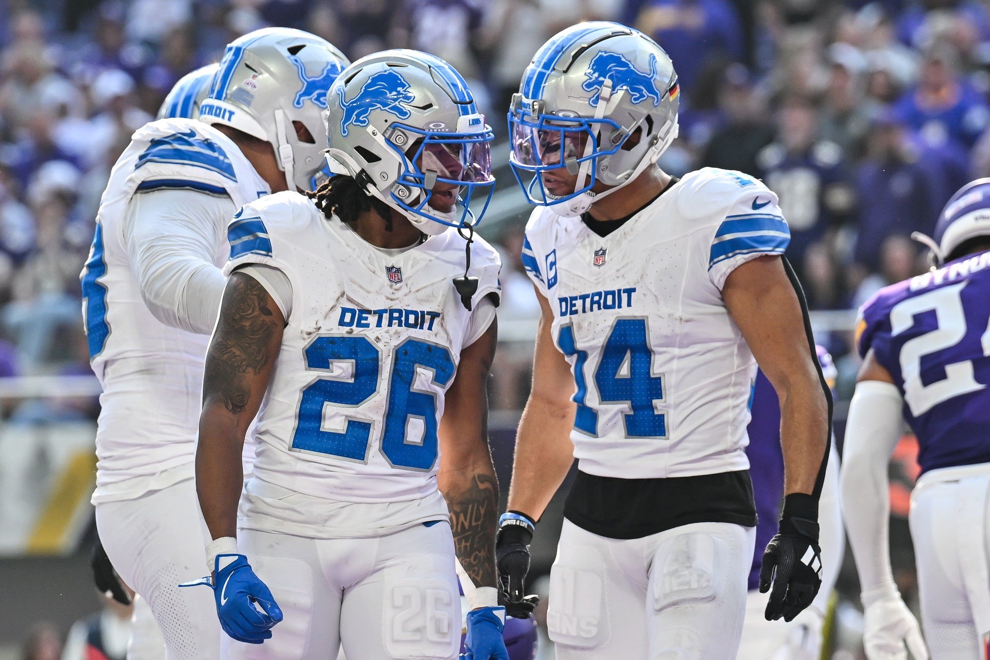 Oct 20, 2024; Minneapolis, Minnesota, USA; Detroit Lions running back Jahmyr Gibbs (26) reacts with wide receiver Amon-Ra St. Brown (14) after running for an 8 yard touchdown during the second quarter against the Minnesota Vikings at U.S. Bank Stadium.