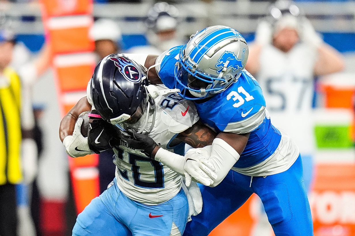 Detroit Lions safety Kerby Joseph (31) tackles Tennessee Titans running back Tony Pollard (20) during the first half at Ford Field in Detroit on Sunday, Oct. 27, 2024.