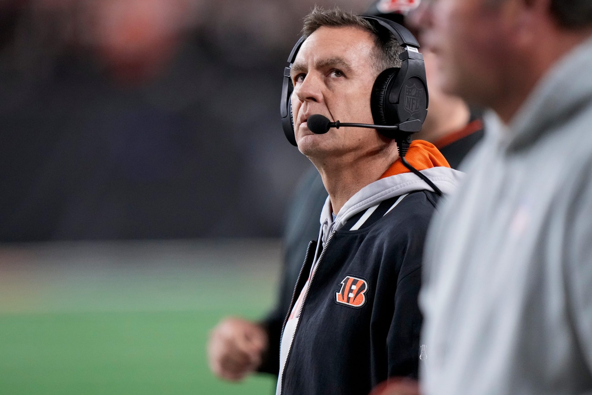 Cincinnati Bengals defensive coordinator Lou Anarumo watches a replay of the Denver Broncos wide receiver Marvin Mims Jr. (19) touchdown on the video board in the fourth quarter of the NFL Week 17 game between the Cincinnati Bengals and the Denver Broncos at Paycor Stadium in downtown Cincinnati on Saturday, Dec. 28, 2024. The Bengals took a 30-24 win in overtime to remain in the post season chase.