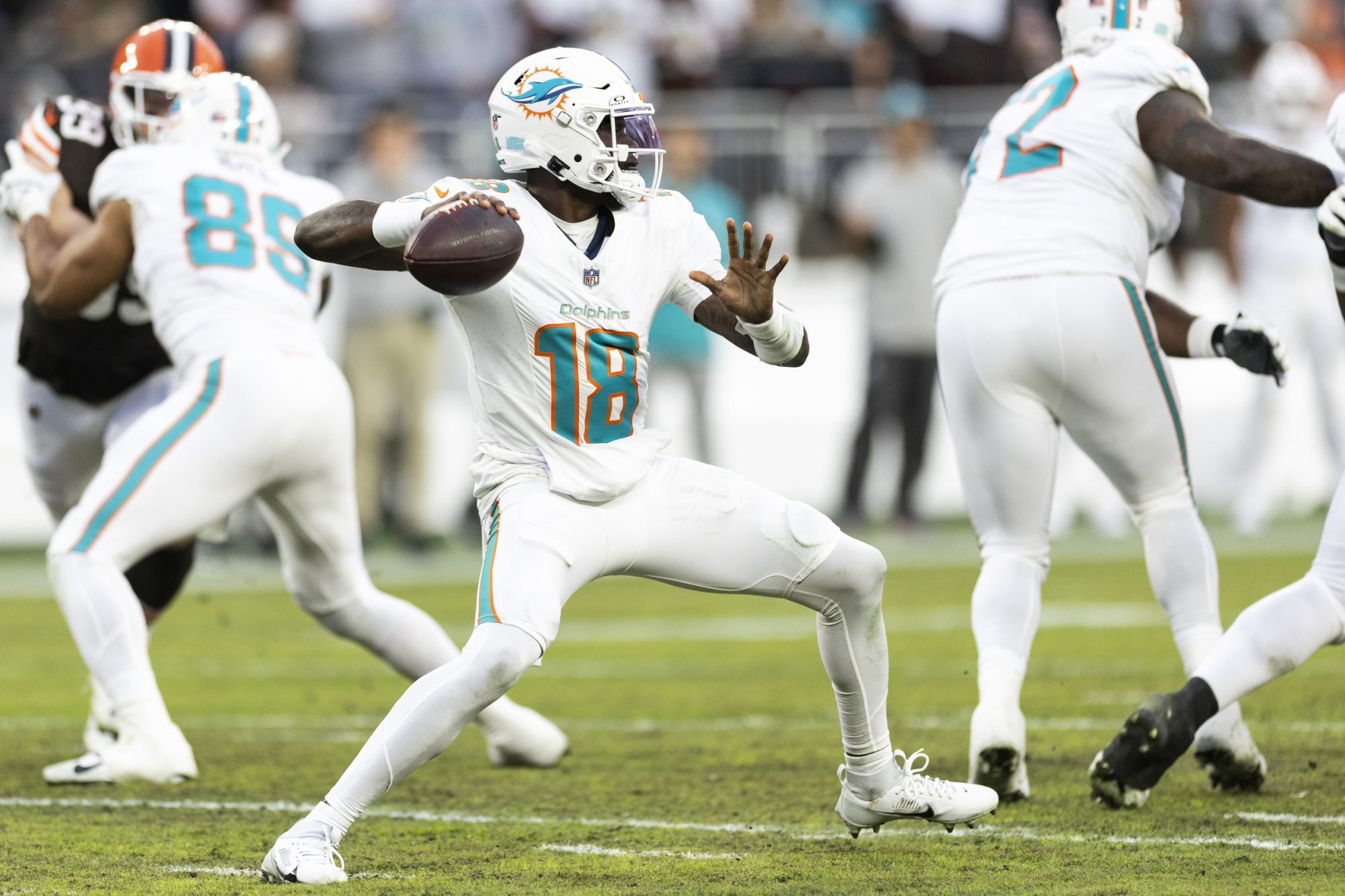 Dec 29, 2024; Cleveland, Ohio, USA; Miami Dolphins quarterback Tyler Huntley (18) throws the ball against the Cleveland Browns during the second quarter at Huntington Bank Field.