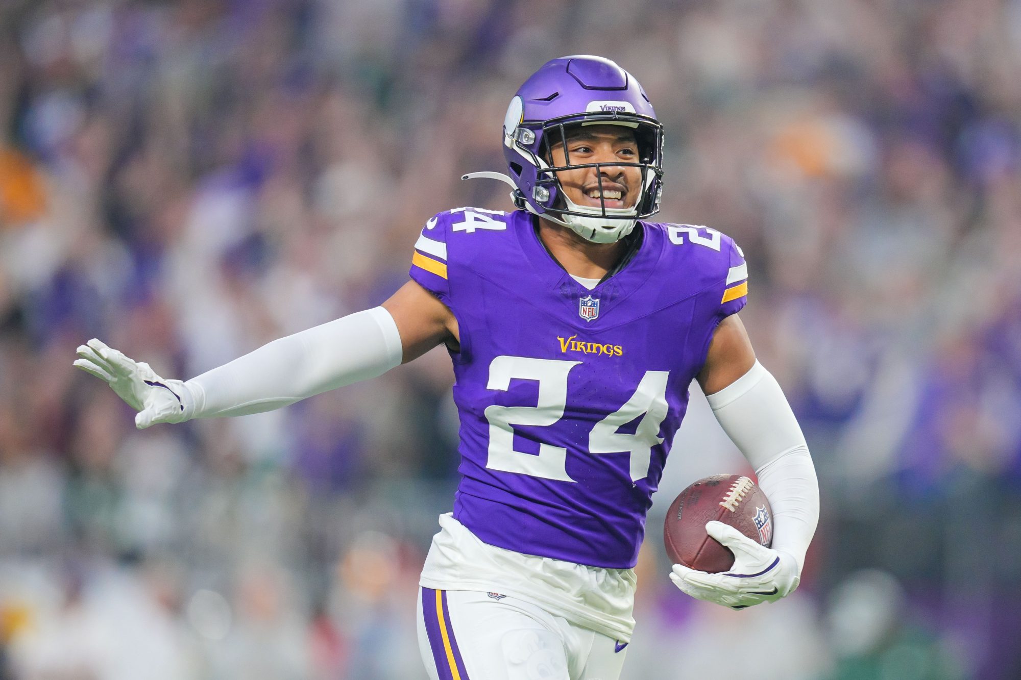 Dec 29, 2024; Minneapolis, Minnesota, USA; Minnesota Vikings safety Camryn Bynum (24) celebrates his fumble recovery against Green Bay Packers in the first quarter at U.S. Bank Stadium.