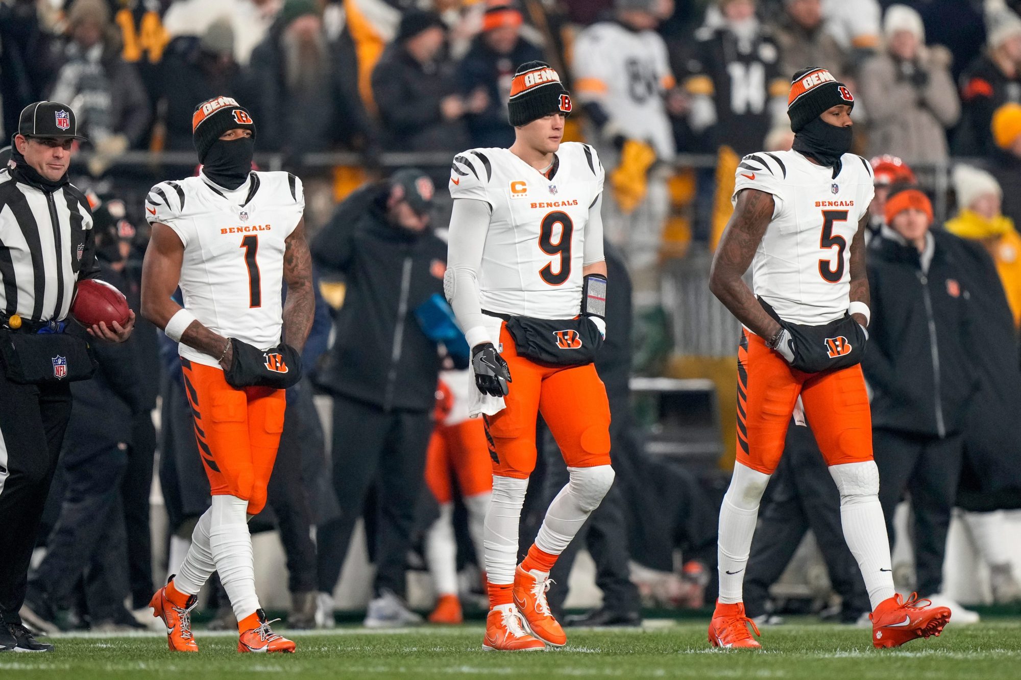 Cincinnati Bengals wide receiver Ja'Marr Chase (1), quarterback Joe Burrow (9) and wide receiver Tee Higgins (5) take the field as captains for the coin toss before the first quarter of the NFL Week 18 game between the Pittsburgh Steelers and the Cincinnati Bengals at Acrisure Stadium in Pittsburgh on Saturday, Jan. 4, 2025.