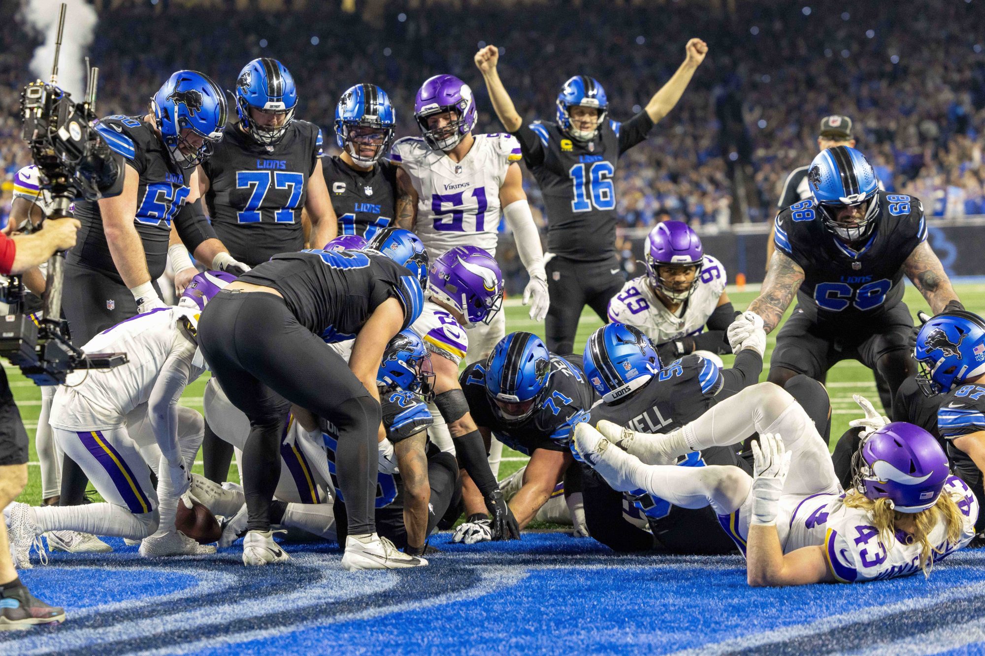 Jan 5, 2025; Detroit, Michigan, USA; Detroit Lions running back Jahmyr Gibbs (26) scores a touchdown against the Minnesota Vikings during the second half at Ford Field.