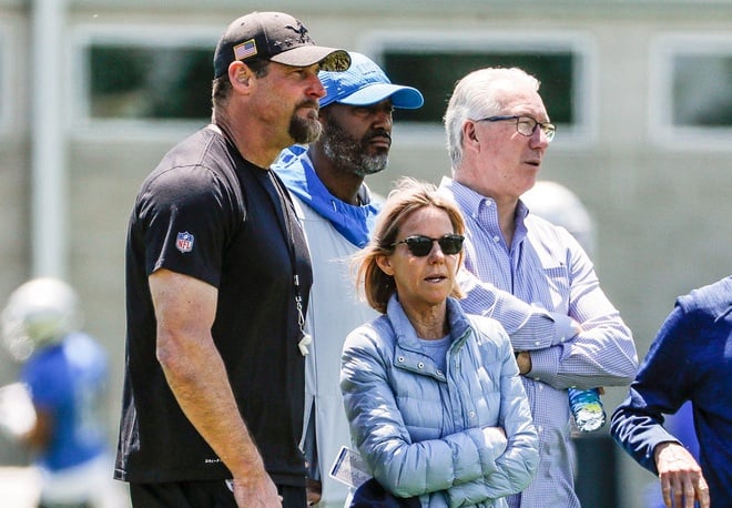 From left, Detroit Lions head coach Dan Campbell, general manager Brad Holmes, owner Sheila Ford Hamp and president Rod Wood watch practice during organized team activity at Lions headquarters in Allen Park, Thursday, May 27, 2021.