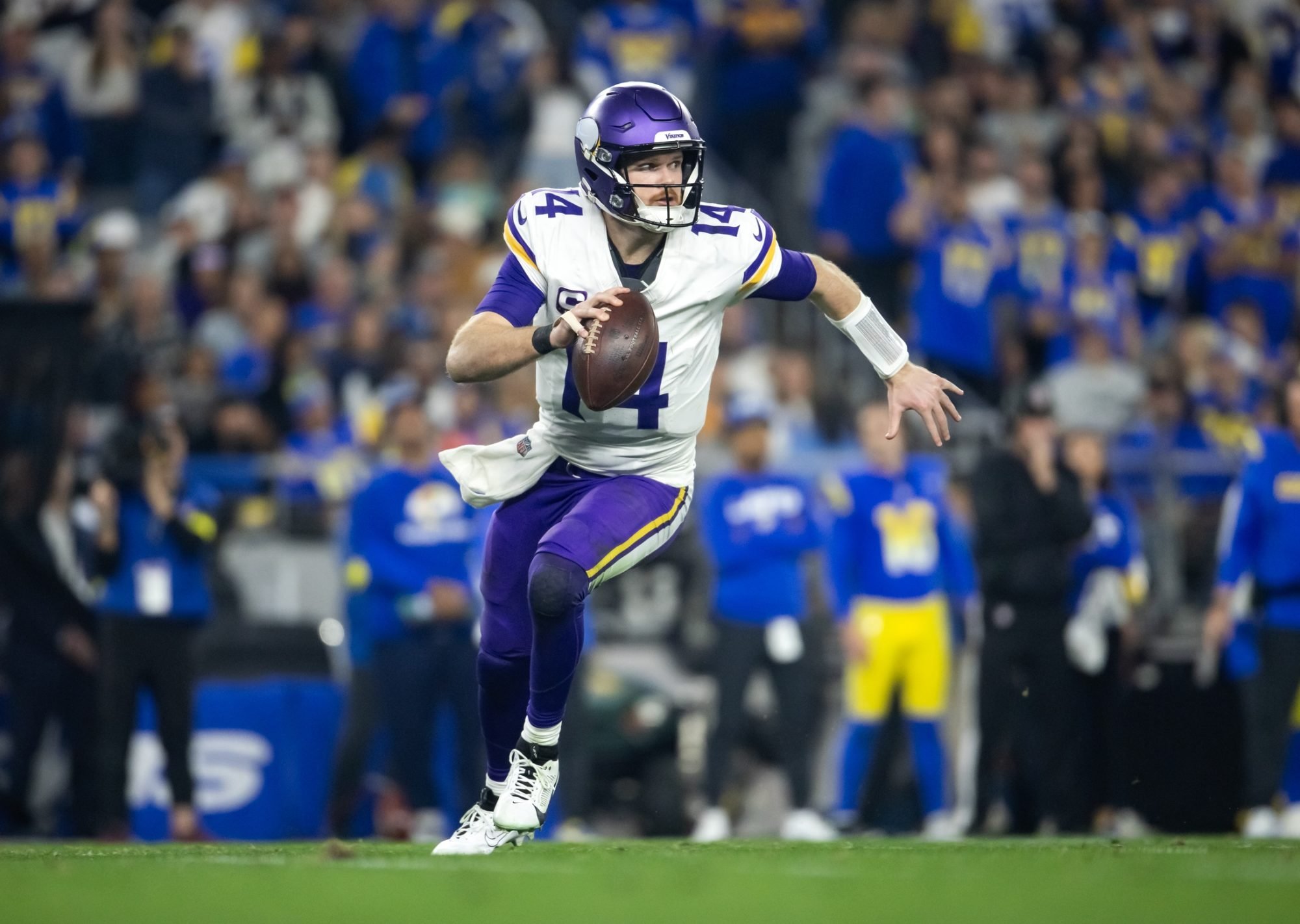 Jan 13, 2025; Glendale, AZ, USA; Minnesota Vikings quarterback Sam Darnold (14) against the Los Angeles Rams during an NFC wild card game at State Farm Stadium.