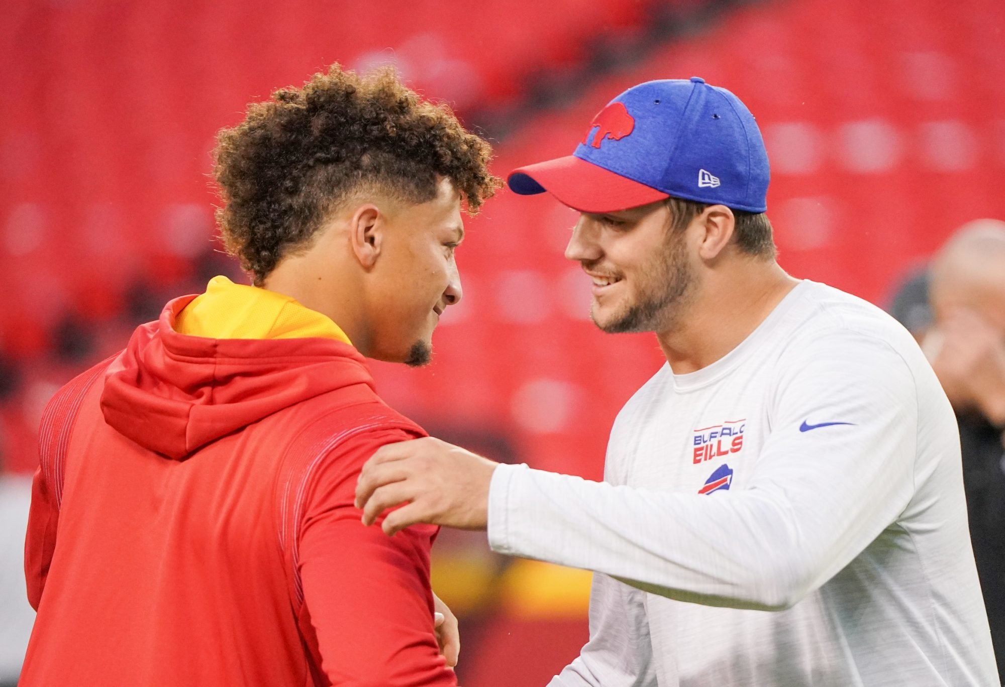 Oct 10, 2021; Kansas City, Missouri, USA; Kansas City Chiefs quarterback Patrick Mahomes (15) talks with Buffalo Bills quarterback Josh Allen (17) before warm ups at GEHA Field at Arrowhead Stadium.