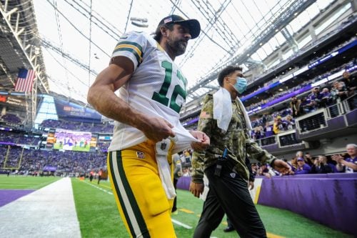 Nov 21, 2021; Minneapolis, Minnesota, USA; Green Bay Packers quarterback Aaron Rodgers (12) walks off the field after the game against the Minnesota Vikings at U.S. Bank Stadium.