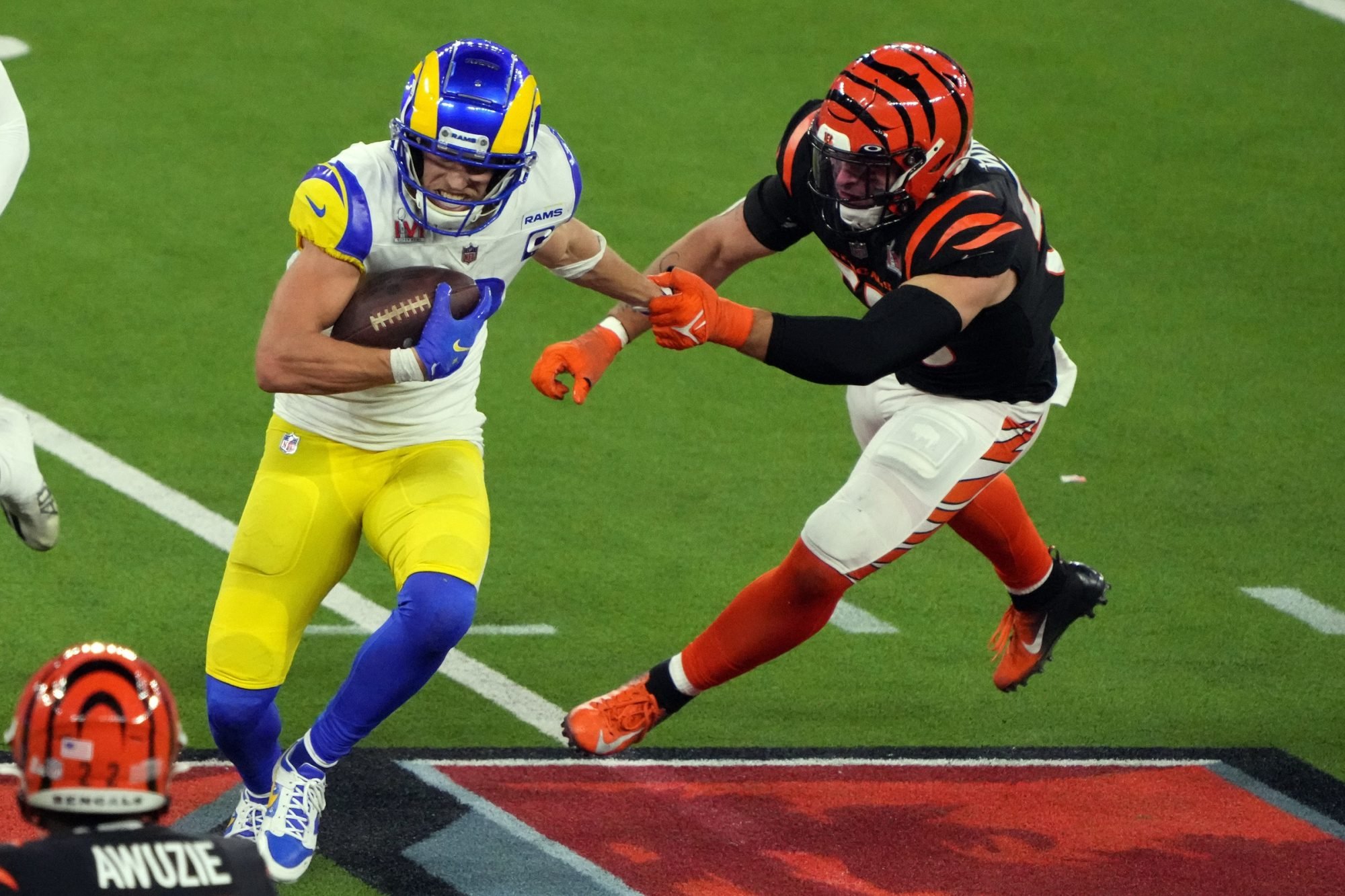 Feb 13, 2022; Inglewood, California, USA; Los Angeles Rams wide receiver Cooper Kupp (10) runs against Cincinnati Bengals inside linebacker Logan Wilson (55) in the fourth quarter in Super Bowl LVI at SoFi Stadium.