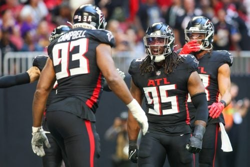 Nov 5, 2023; Atlanta, Georgia, USA; Atlanta Falcons defensive tackle Calais Campbell (93) celebrates with defensive tackle Ta'Quon Graham (95) after a safety against the Minnesota Vikings in the first half at Mercedes-Benz Stadium.