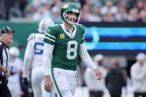 Nov 17, 2024; East Rutherford, New Jersey, USA; New York Jets quarterback Aaron Rodgers (8) reacts during the first quarter against the Indianapolis Colts at MetLife Stadium.