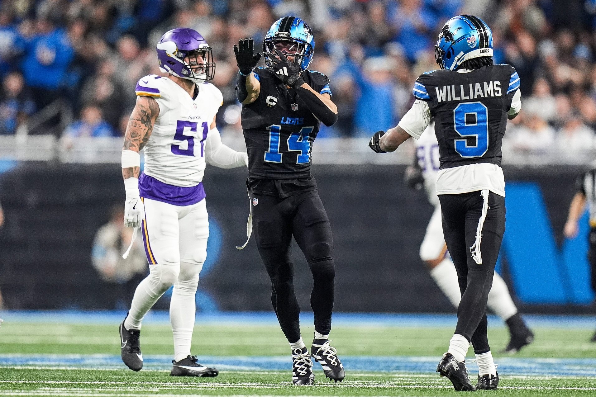 Detroit Lions wide receiver Amon-Ra St. Brown (14) celebrates a first down against Minnesota Vikings during the first half at Ford Field in Detroit on Sunday, Jan. 5, 2025.