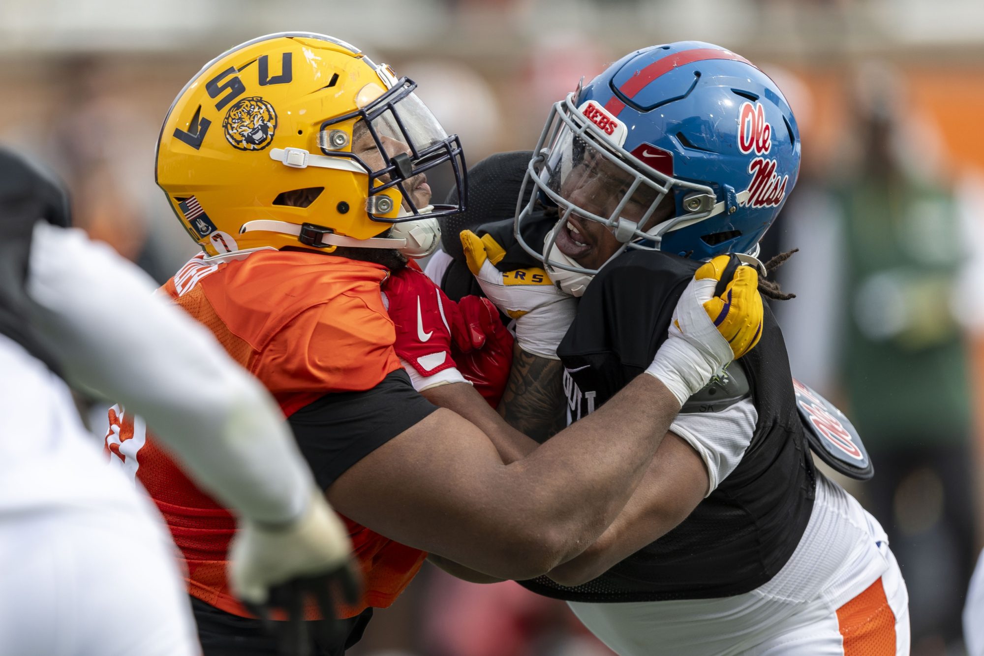 Jan 28, 2025; Mobile, AL, USA; American team offensive lineman Miles Frazier of LSU (70) spars with American team defensive lineman Walter Nolen of Ole Miss (2) during Senior Bowl practice for the American team at Hancock Whitney Stadium.