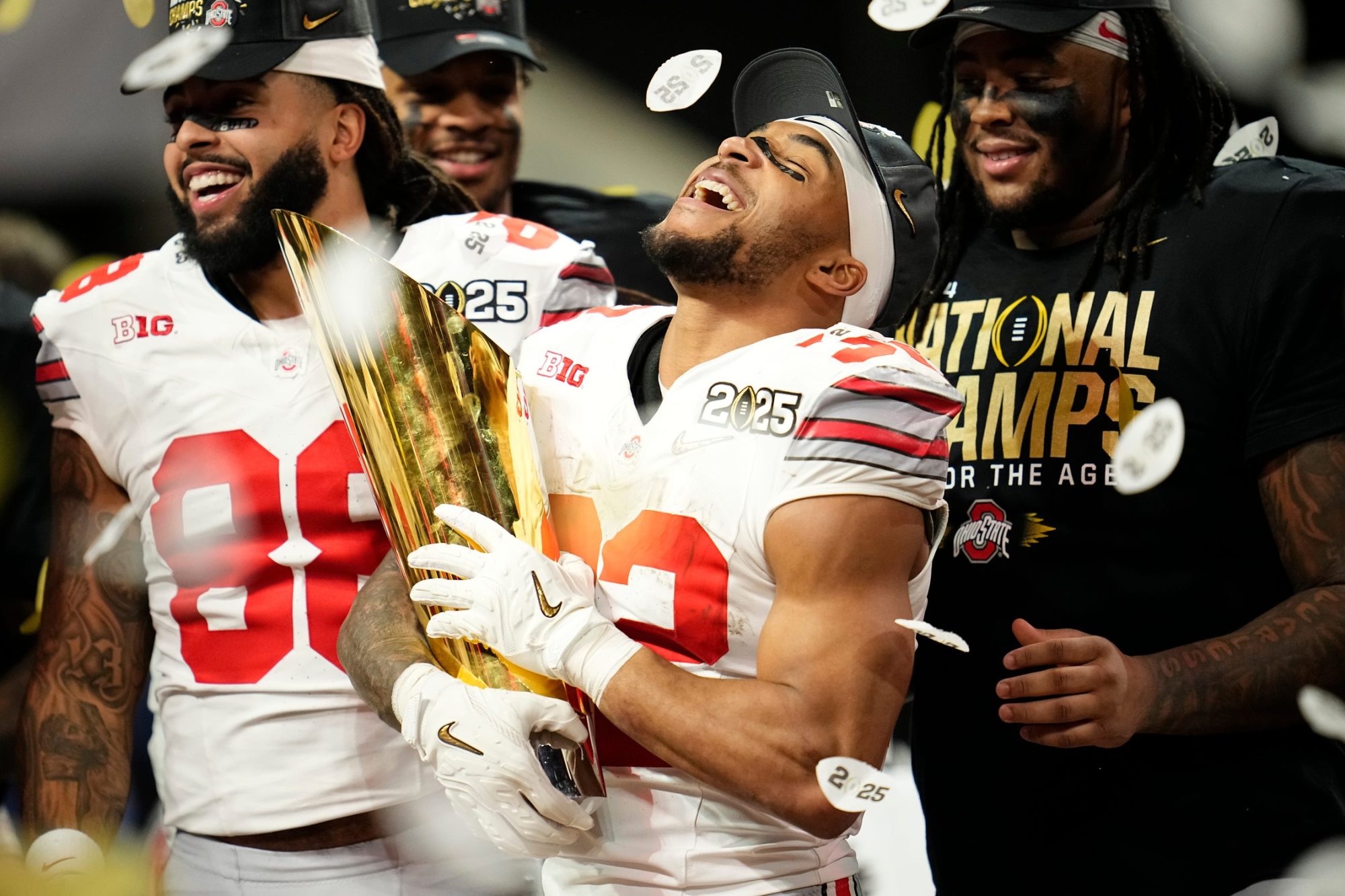 Ohio State Buckeyes running back TreVeyon Henderson (32) celebrates with the trophy following the 34-23 win over the Notre Dame Fighting Irish to win the College Football Playoff National Championship at Mercedes-Benz Stadium in Atlanta on Jan. 22, 2025.