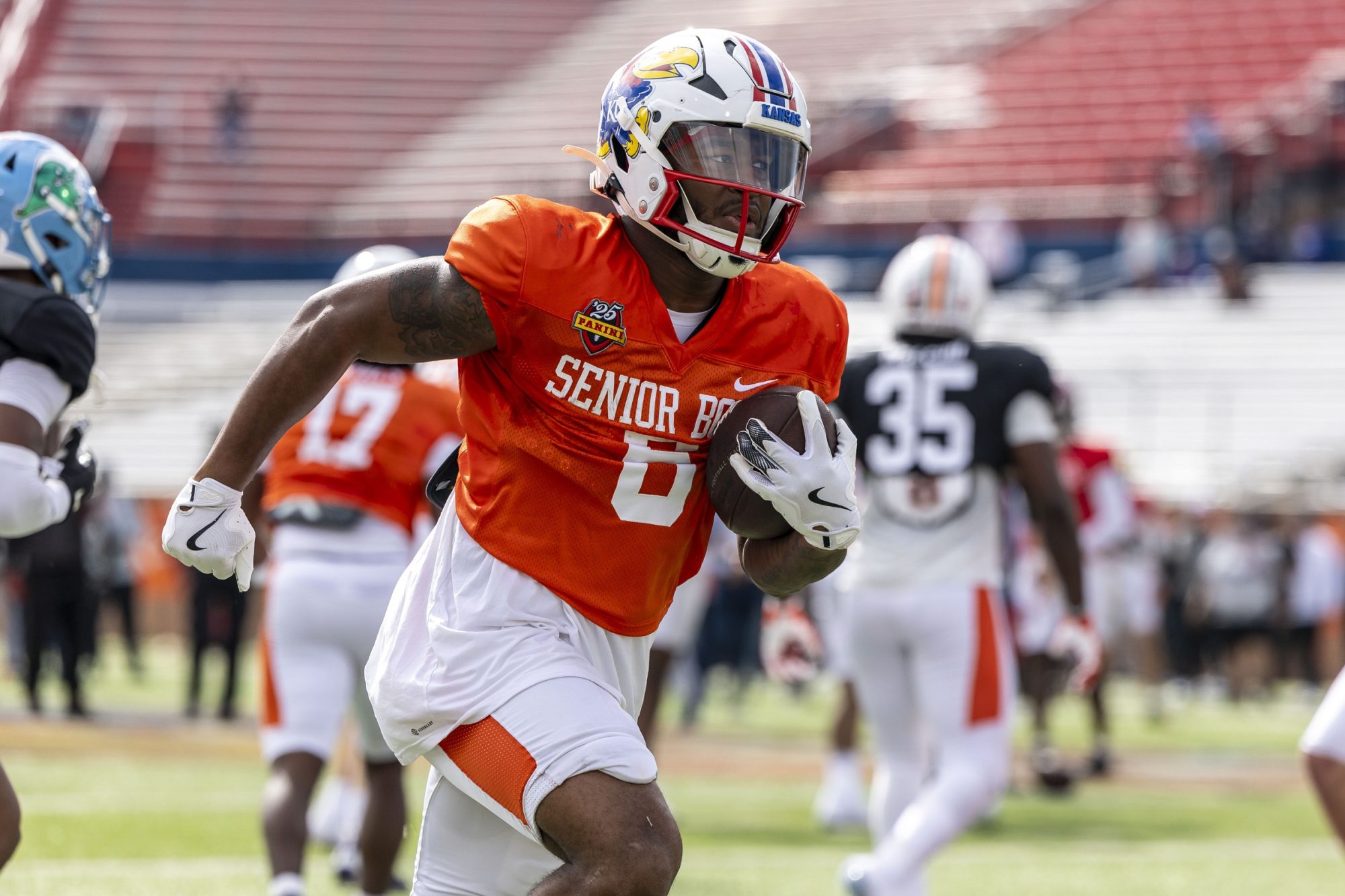 Jan 30, 2025; Mobile, AL, USA; American team running back Devin Neal of Kansas (6) works through drills during Senior Bowl practice for the American team at Hancock Whitney Stadium.