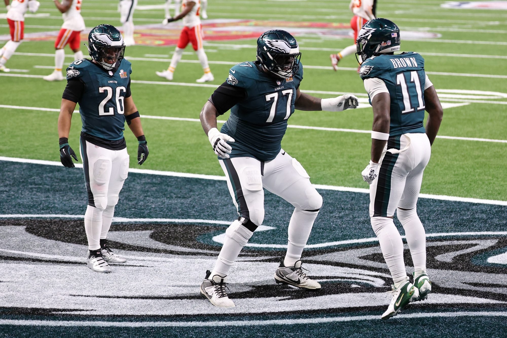 Feb 9, 2025; New Orleans, LA, USA; Philadelphia Eagles wide receiver A.J. Brown (11) celebrates with offensive tackle Mekhi Becton (77) after scoring a touchdown against the Kansas City Chiefs during the first half of Super Bowl LIX at Caesars Superdome.